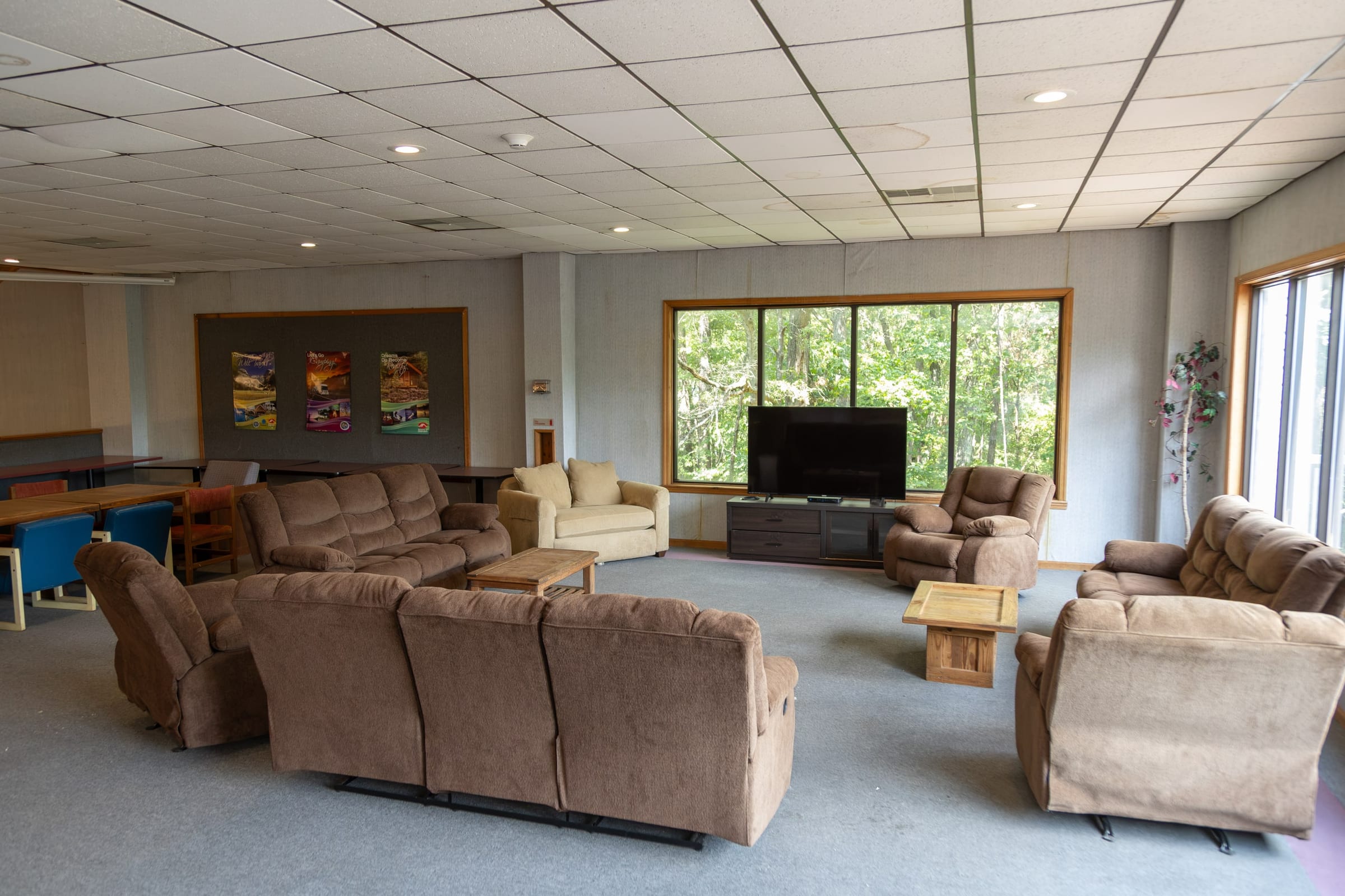 Recliner lounge around the TV in the community room
