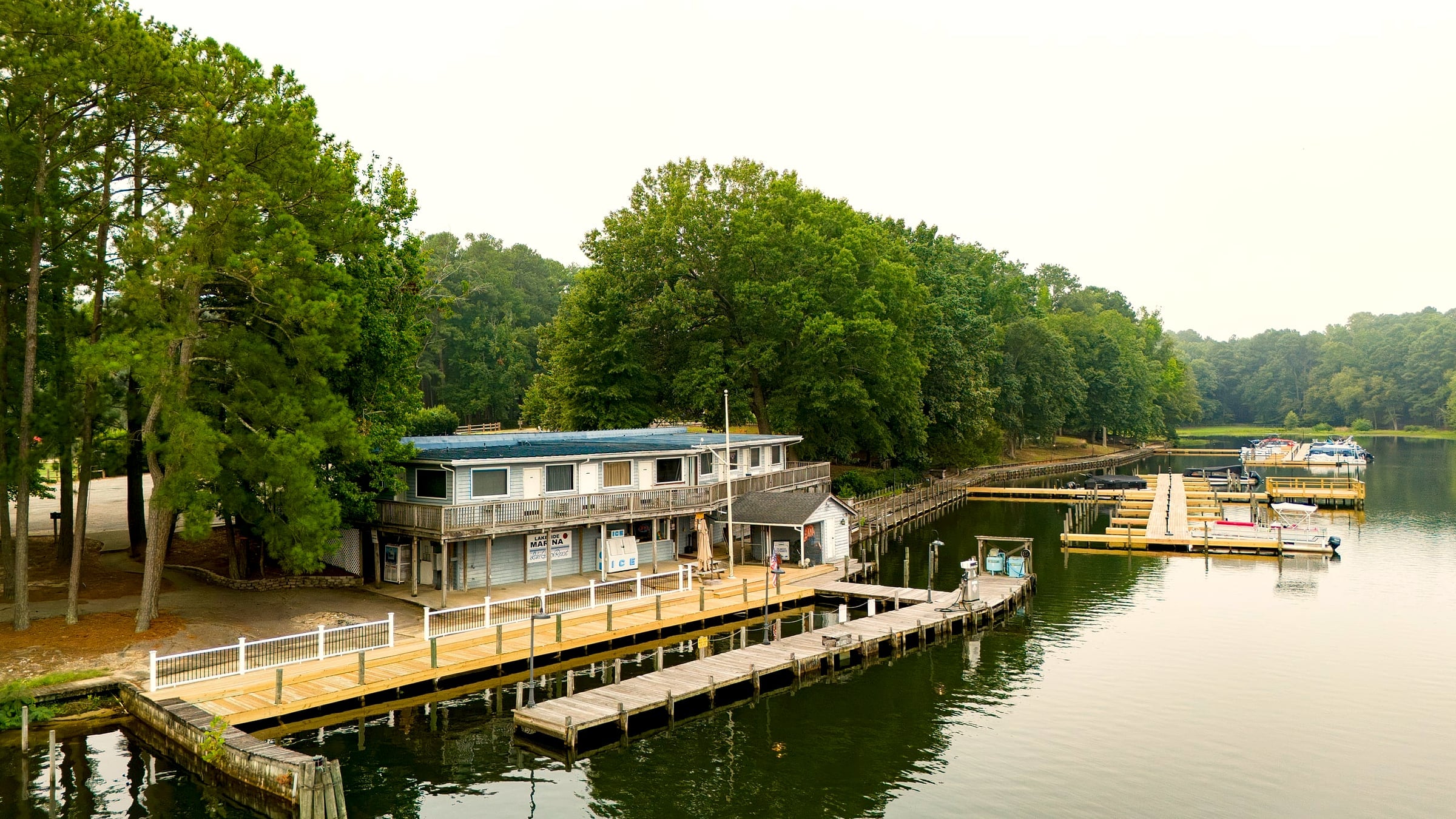 Aerial of the marina store, two-story building and rebuilt docks along the channel