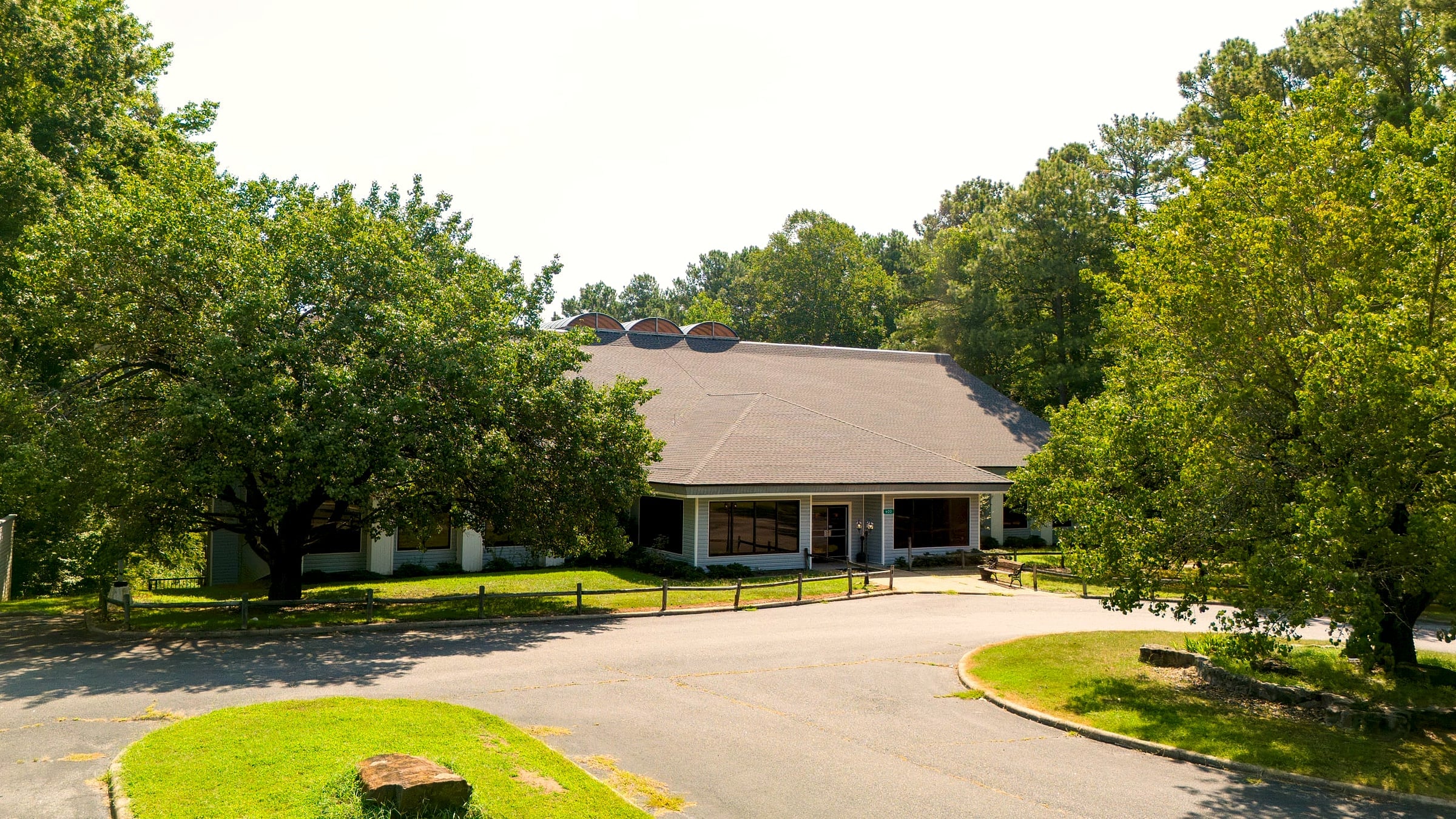 The Boulder House entrance and circular drive from low altitude
